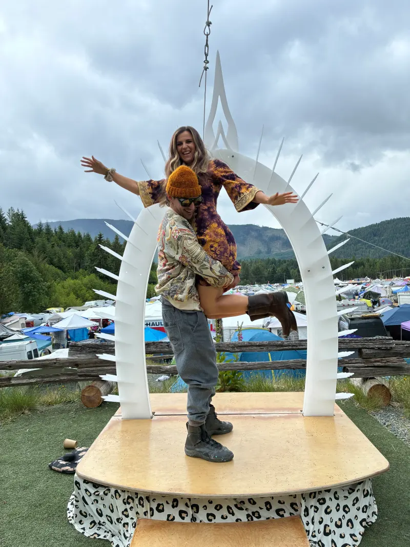 A couple standing on the platform beneath the Wild Union Arch